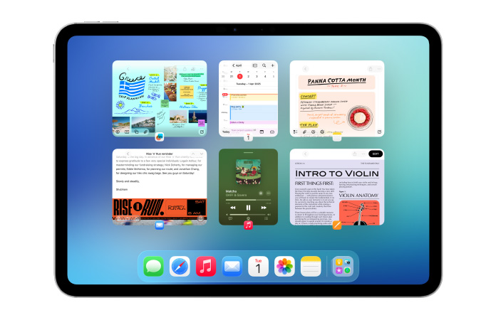 iPad, landscape orientation, screen shows multiple apps like Calendar and Music app in six windows lined up in two rows to show windows equally